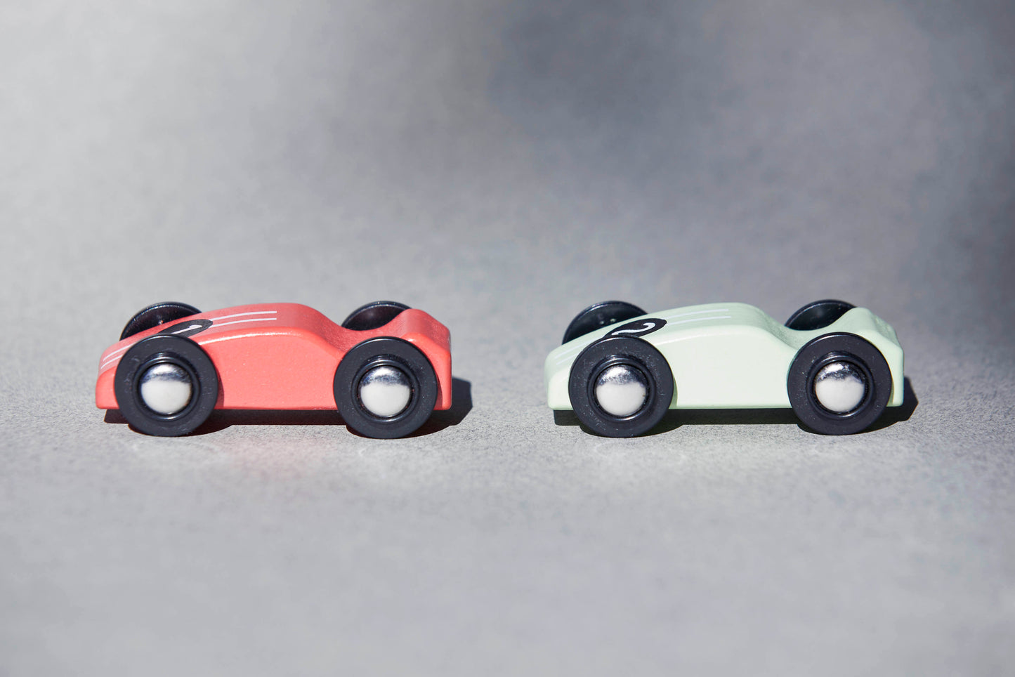 2 stylish retro wooden racing cars, made from sustainable FSC timber and environmentally friendly paint.