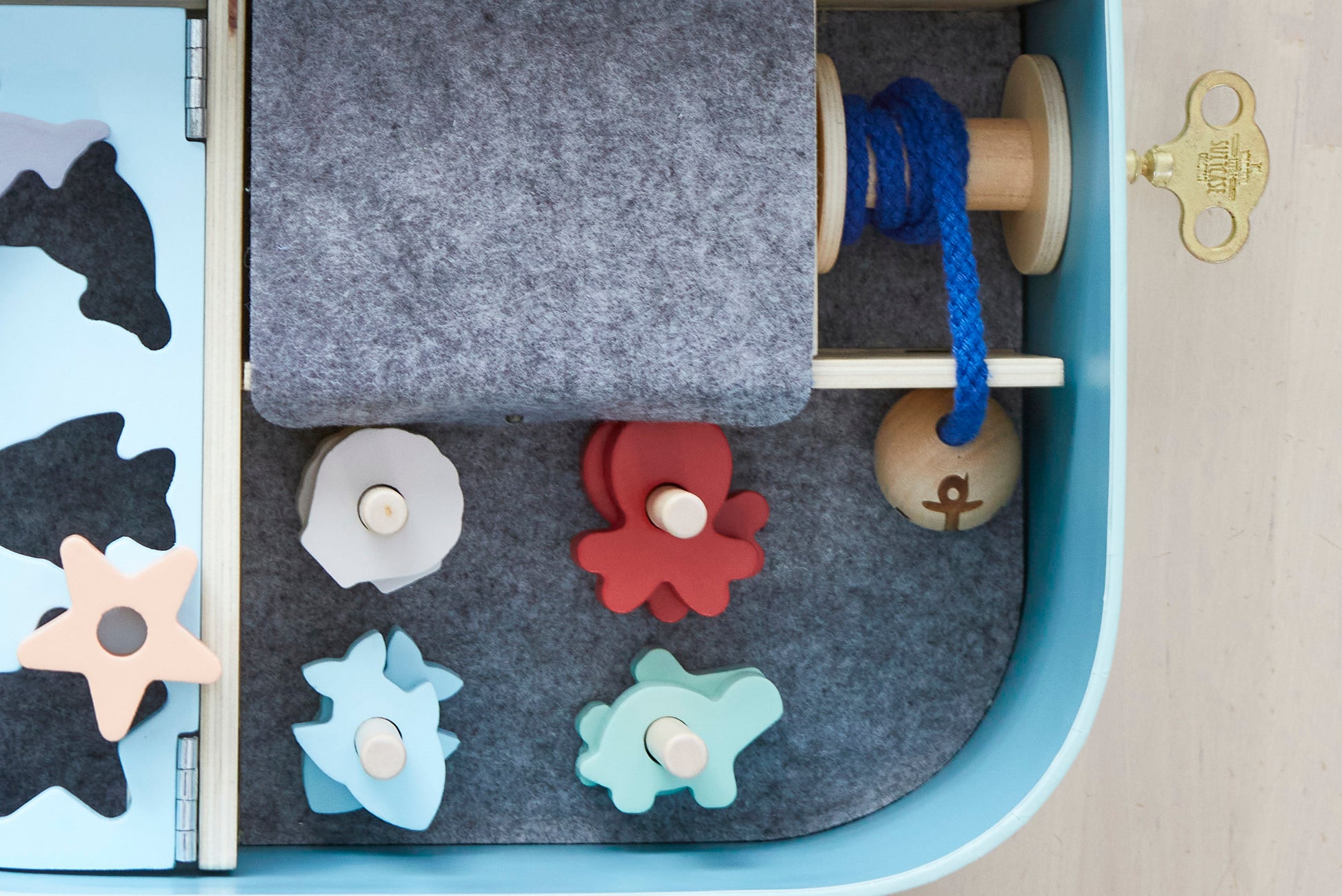 Ocean Lover Suitcase. Includes 1 treasure key, 16 wooden sea shapes, stickers and name tag for customising. Suitcase size 300 x 215 x 100 mm. Materials: sustainable & recycled materials (FSC timber, recycled felt, cardboard). Original, educational and ethically produced. Supporting cognitive, fine motor, problem solving skills & imaginative play. Easy to pack and carry around. Suitable for children age 3+ years.  Designed and prototyped in Australia. Environmentally friendly packaging.