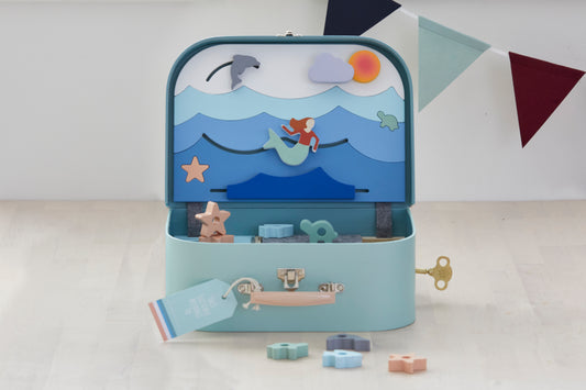 Ocean Lover Suitcase. Includes 1 treasure key, 16 wooden sea shapes, stickers and name tag for customising. Suitcase size 300 x 215 x 100 mm. Materials: sustainable & recycled materials (FSC timber, recycled felt, cardboard). Original, educational and ethically produced. Supporting cognitive, fine motor, problem solving skills & imaginative play. Easy to pack and carry around. Suitable for children age 3+ years.  Designed and prototyped in Australia. Environmentally friendly packaging.